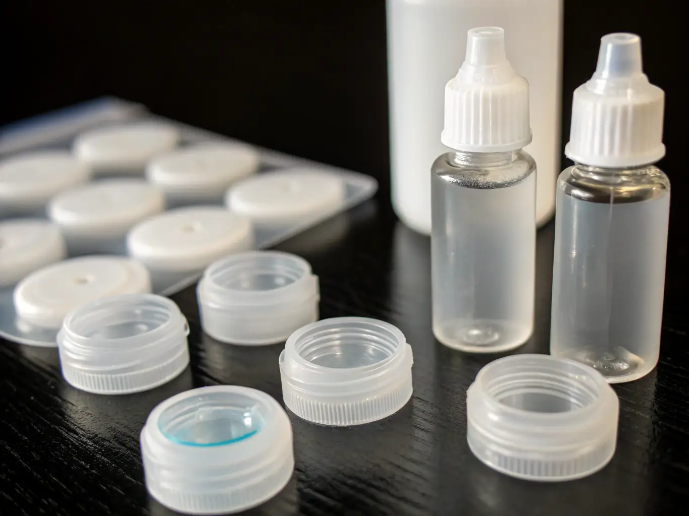 A pair of finished glasses is being carefully packaged in a protective case, ready for delivery to the client's home.